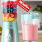 Mueller personal blender with 15 oz travel cup and secure lid, shown on kitchen counter.