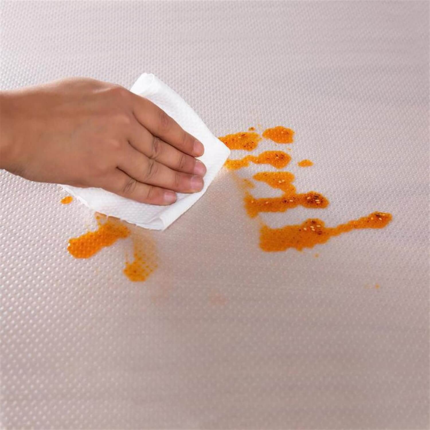 Easy-clean clear shelf protector on kitchen shelf