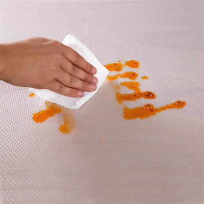 Easy-clean clear shelf protector on kitchen shelf