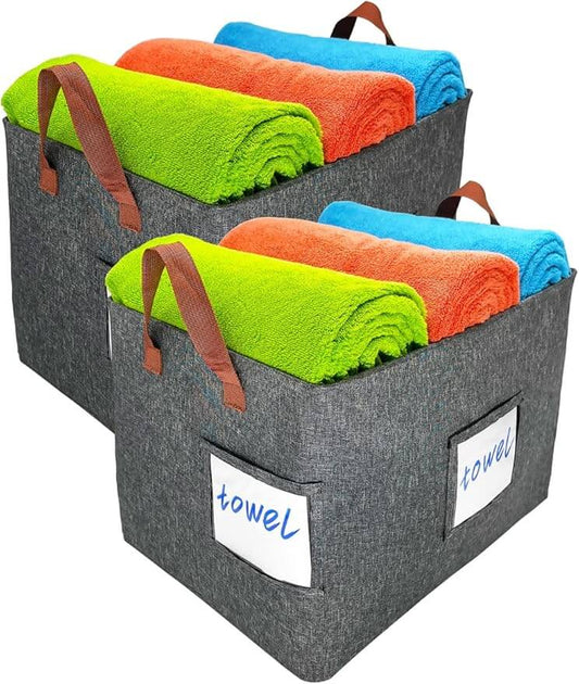 Set of two gray Zebricolo storage baskets neatly placed on wooden shelf.